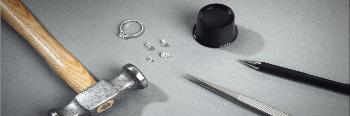 Diamonds and rings next to repair tools