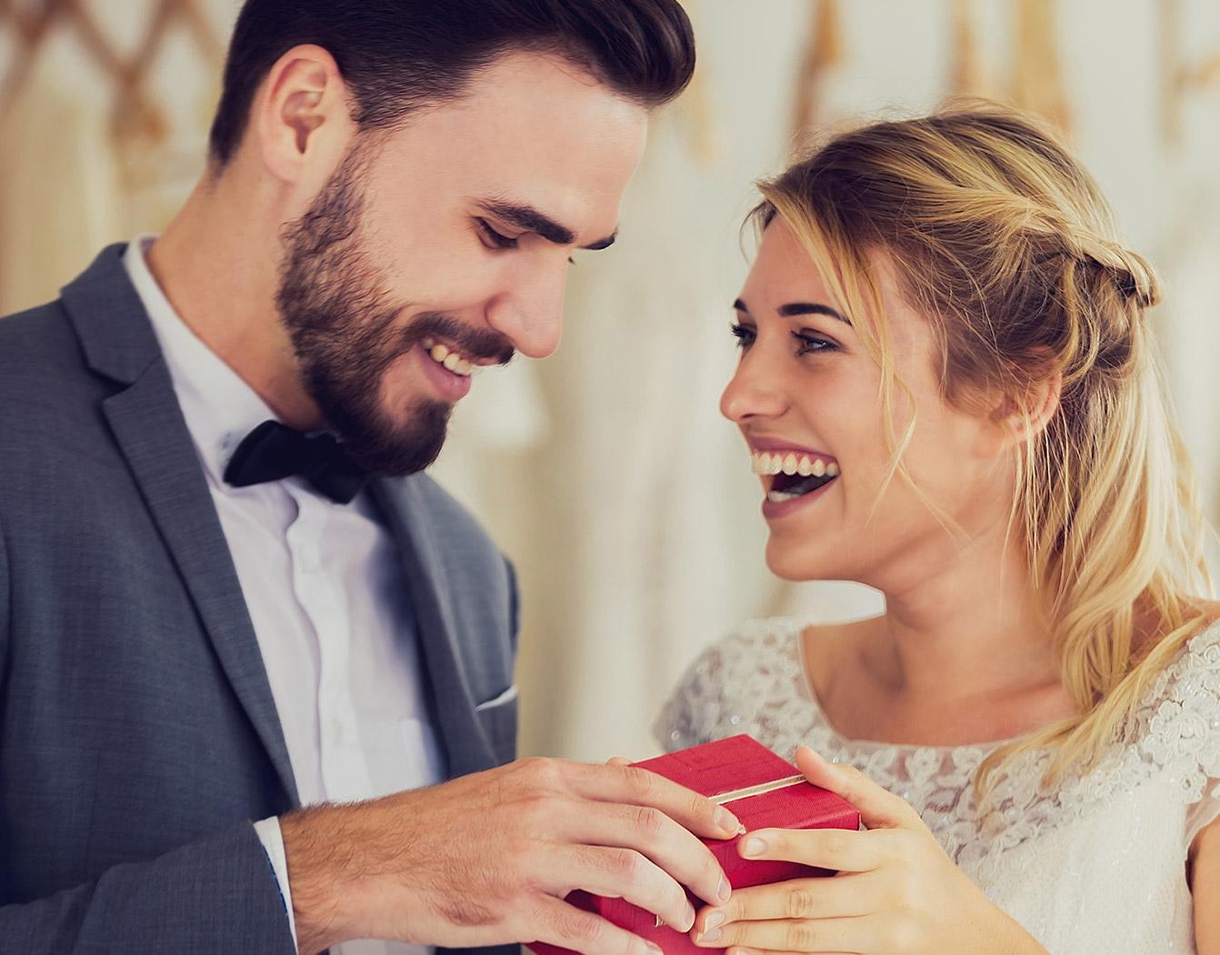 Couple opening wedding gift