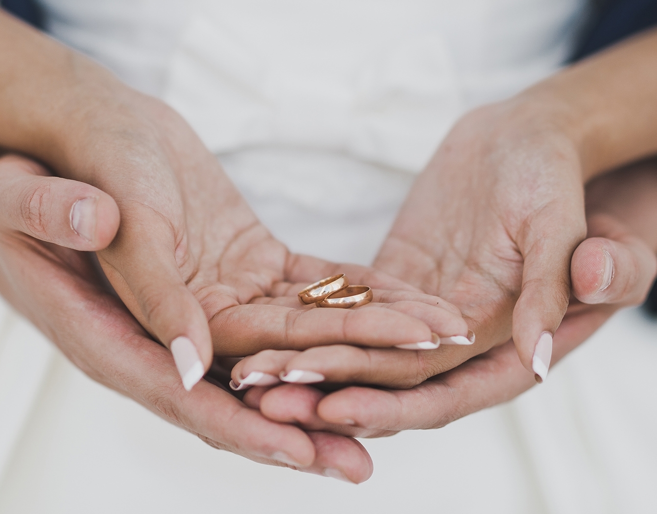 wedding rings in hand